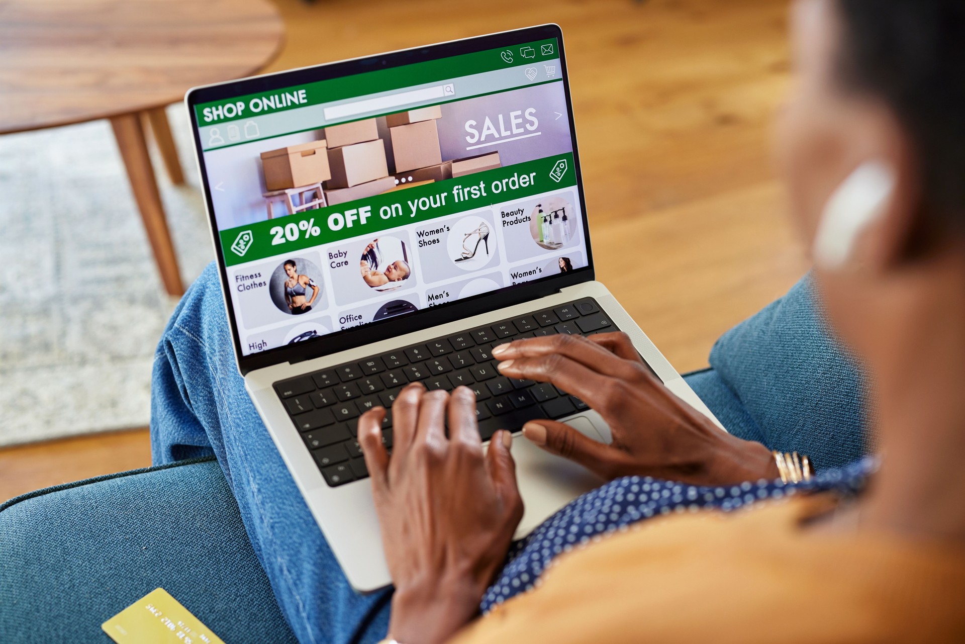 African american woman doing shopping online using laptop